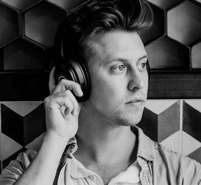man listening to music on headphones